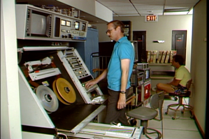 Don Kent operates Ampex AVR-1 donated to UCLA by KTLA, Los Angeles during 1988 transfer of very early color videotapes recorded at NBC, Burbank in 1958-1960 with the RCA Labs color process. These Quad Tapes were transferred to D-2 digital tapes and then edited into digital master tapes. Image capture via Don Kent from KTLA News videotape.